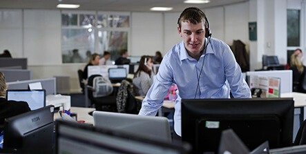Man on headset in a call center